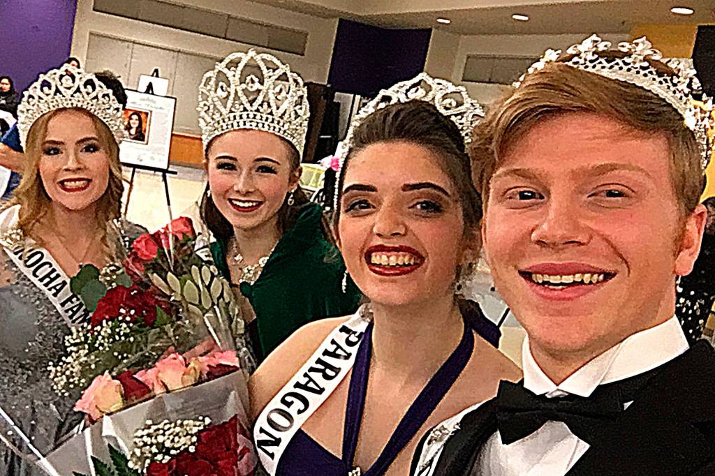 Above: Last years Irrigation Festival royalty queen Emily Silva and princesses Brianna Cowan, Kjirstin Foresman and Shelby Wells embrace on stage after saying their goodbyes to the crowd in the Sequim High School auditorium.                                 Right: New royals, from left, princess Olivia Preston, queen Lindsey Coffman, princess Alicia Pairadee, and prince Logan Laxson, take their first selfie together on March 7. Photo by Logan Laxson.