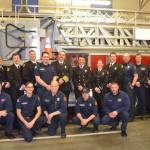 Casey Sires, center, is joined by fellow staff from Clallam County Fire District 3 at a badge pinning ceremony on March 12. Photo courtesy of Clallam County Fire District 3