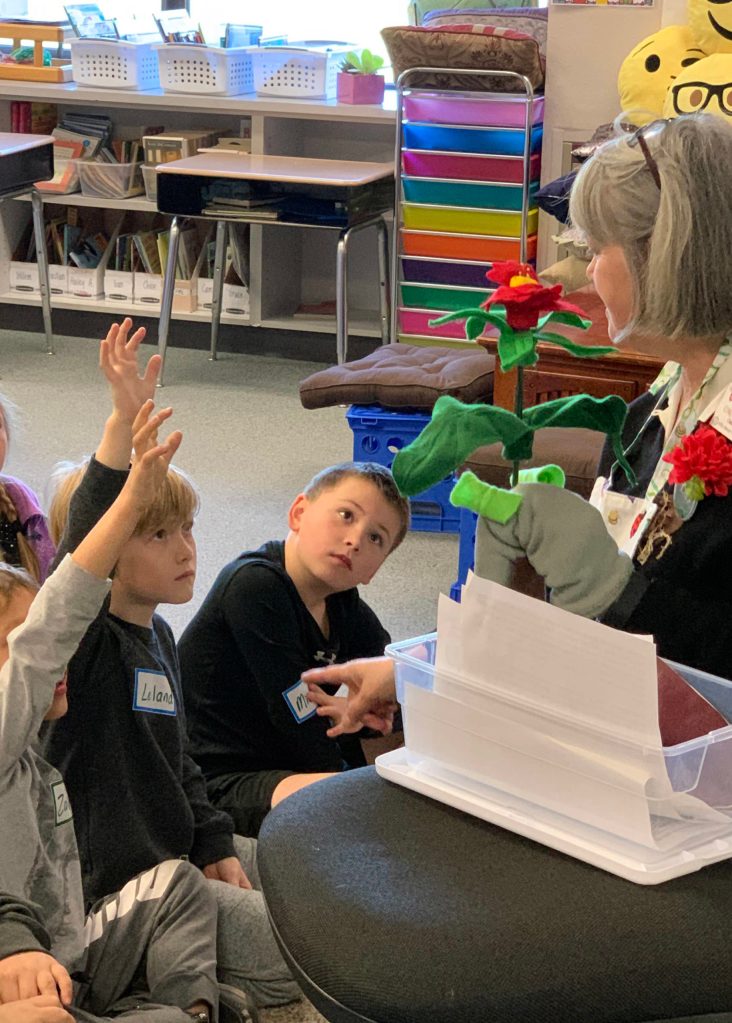 Greywolf Elementary School students Ziden West, Leland Foth and Michael Smith, in Jennifer Newtons class, learn about plant life from Herbie (the puppet) and Clallam County Master Gardeners. Submitted photo