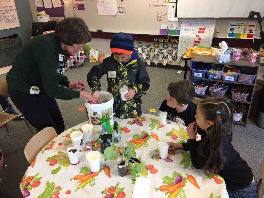 Greywolf Elementary students Jaegar Sapp, Colton Dufour and Giada Snyder from Gretta Richs class get a lesson in plant life from Clallam County Master Gardeners. Submitted photo