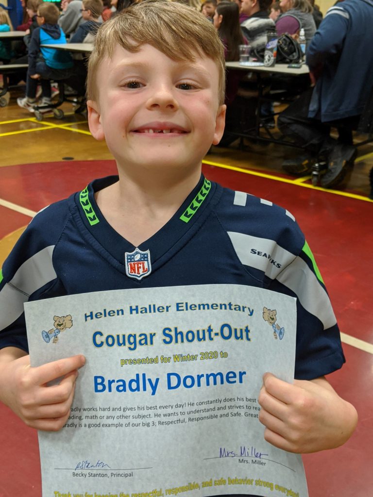 Helen Haller first-grader Bradly Dormer receives a certificate at the Shout Out Dessert event on March 12. Kelly Miller, Dormers teacher, wrote this about him: Bradly works hard and gives his best every day! He constantly does his best whether its reading, math or any other subject. He wants to understand and strives to reach his goals. Bradly is a good example of our Big 3: Respectful, Responsible and Safe. Great work, Bradly! Photo by Renee Mullikin