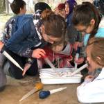 Greywolf students Ariana Beauregard, Maisey French, Colby Waters, Jiada Sabadine and Sasha Yada take part in a hands-on study at Railroad Bridge Park. Photo by Teresa Iversen