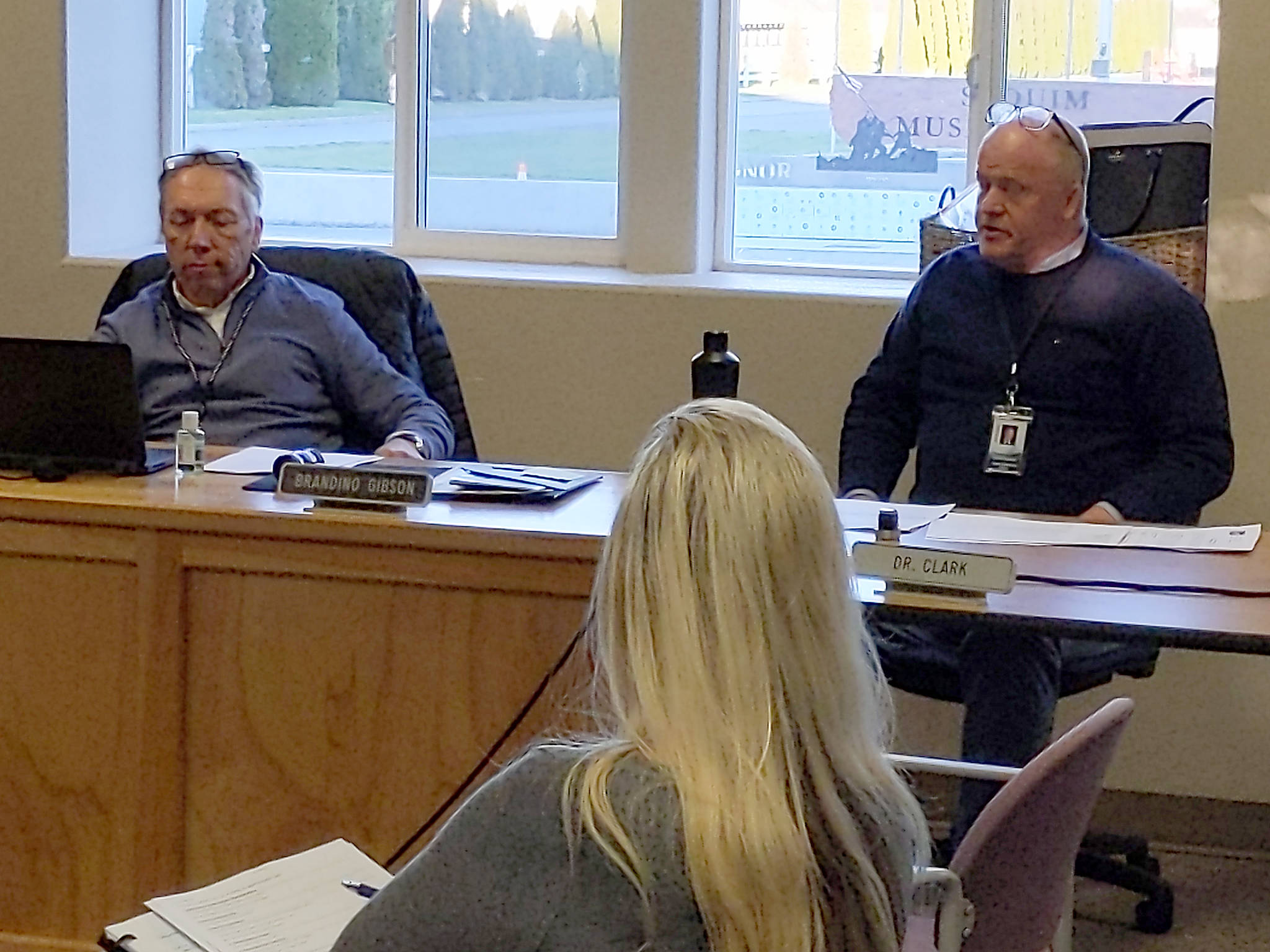 Sequim School District superintendent Rob Clark, right, addresses school board president Brandino Gibson, left, and the rest of the districts board of directors during their March 16 meeting, the conversation in which was dominated by talk of COVID-19 response and planning. Sequim Gazette photo by Conor Dowley
