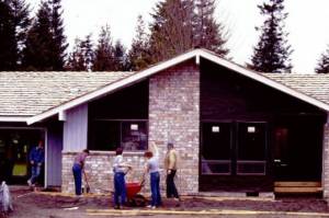 Sequim High School carpentry class students and their shop teacher stand outside the Glen Greathouse building/Rotary House No. 4. Club members partnered with SHS carpentry classes for 10 years and build homes in Sunland to sell, providing a hands-on education for students looking to pursue trade work.