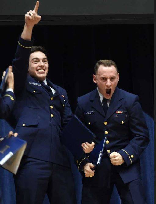 Sequim High grad Miguel Moroles, right, and fellow U.S. Coast Guard Academy students celebrate their academy flight school nomination. Submitted photo