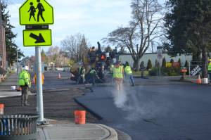 Lakeside Industries and Interwest Construction plan to start and finish paving West Fir Street this week. They started March 31 at the intersection of West Fir Street and North Sequim Avenue. Sequim Gazette photo by Matthew Nash
