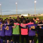Sequim High Schools boys soccer team gathers at halftime during a spring 2019 league match. The stadium will be illuminated for 20 minutes at 8:20 p.m. (20:20 military time) on April 17 in honor of the spring prep athletes unable to complete their season after all state schools were closed in mid-March. Sequim Gazette file photo by Matthew Nash