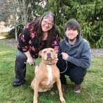 Left, Jessica Dowe, an Olympic Peninsula Humane Society staff member, holds OPHS resident Lulu. Above, Port Angeles resident Karen Dopheide and her son Maxwell are pictured with Athena, whom they adopted from OPHS. Staff said that though Athena was loved by each volunteer and staff member at the shelter she had to be an only animal in the house and so she kept getting passed Over. Athena spent six years at the humane society before being adopted by Dopheide. Photos courtesy of Olympic Peninsula Humane Society