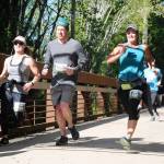 Runners reach the finish line at the Race the Peninsula series Railroad Bridge 5k/10k in Sequim in 2019. Sequim Gazette file photo by Michael Dashiell