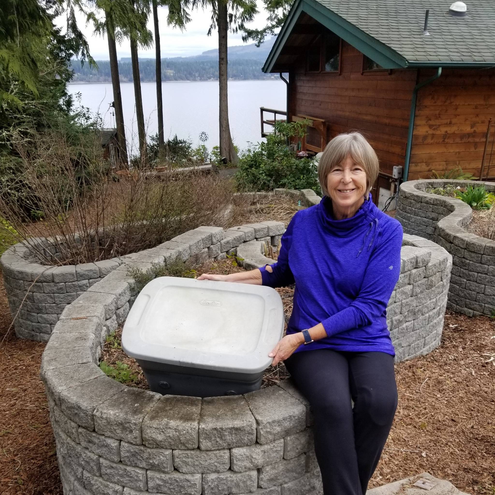 Master Gardener Judy Mann, pictured here with her worm bin, has been enjoying the vermicompost her worms have produced for more than 10 years. She offers a Worm Composting presentation on April 23. Photo courtesy of Judy Mann