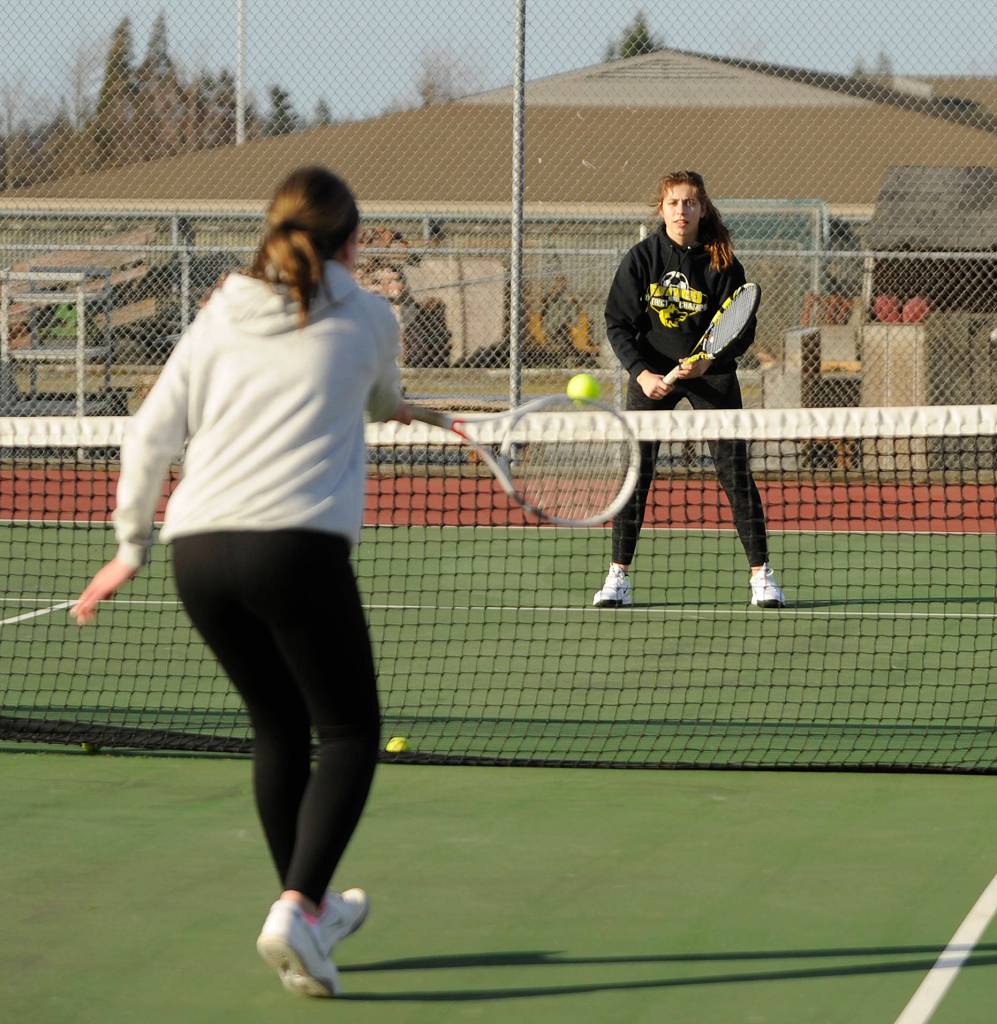 Doubles team partners Kalli Wiker (foreground) and Jessica Dietzman, pictured at a preseason practice in early March, looked to defend their 2A title this spring; the 2019-2020 school year closure ended their season before it began and ended Dietzmans prep sports career. Sequim Gazette file photo by Michel Dashiell