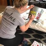 Ashleigh Cate decorates a bucket for goodies she plans to give to graduate-to-be Connor Forderer. She and her family adopted Connor as part of the Sequim High School Adopt a Senior 2020 Facebook program because she plans to enlist in the US Army as as a medic, and Connor plans to enlist in the US Marines. Photo courtesy of Chad Cate