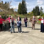 Ladies of a Wednesday breakfast group living on Highland Hills decided to surprise their neighbor, Sheron Duffy, on April 29 by turning up outside her driveway on Ravens Ridge to bring cards, flowers and sing to her Happy Birthday. Photo courtesy of Kathryn Haskell