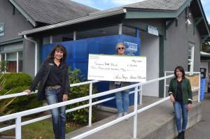 On May 1, Sequim First Federal branch managers, Lorie Fazio, Sequim Village Marketplace, left, and Anna Ellison, Sequim Avenue, right, donated $10,000 to the Sequim Food Bank with Executive Director Andra Smith accepting the funds. Sequim Gazette photo by Matthew Nash