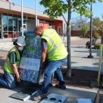 Gary Meyer and Josh Henning, crew members from the City of Sequims Public Works Department, install a Bigbelly automated trash and recycling station at the Sequim Civic Center Plaza. Photo courtesy of City of Sequim