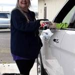 Sharon Clayton, president of the Sunbonnet Sue Quilt Club, accepts a donation of face masks to go to local health officials. Her first call for help from club members resulted in more than 200 face masks which grew into more than 4,500 as of last week. Photo courtesy of Sunbonnet Sue Quilt Club