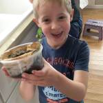 Kindergartener Hank Kalmar is pleased with the root viewer he planted. Photo courtesy of Susan Kalmar
