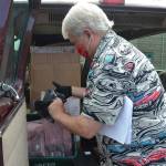 Richard Seiler with Sequim School Districts IT staff preps laptops and docking stations to go into about 170 classrooms across the district for teachers to use next school year. This project follows IT staffs efforts to distribute more than 100 computers to students without computers. Sequim Gazette photo by Matthew Nash