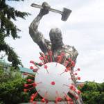 The 2019 novel coronavirus  an artists interpretation anyway  is under attack in Carlsborg. Bruce Cornett said he recently installed the virus-shaped art piece he and his wife Carol designed and created, as an addition to the original metal sculpture by comic book artist Per Berg. It was an idea that came to me some weeks back. We asked on the area Facebook forums for artists to take the idea and run with it … none did. So we did it ourselves. Dave Brasher, owner of High Energy Metals, commissioned Berg in 2012 to plan and piece together the intricate metal man for a display at the custom parts shop on Business Park Loop in Carlsborg. It seemed like a good fit for the ironwork, which is a remarkable piece, Cornett said. Sequim Gazette photo by Michael Dashiell