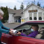 Loretta Bilow holds a practice run with Bonnie Hagberg for the Sequim Prairie Granges upcoming Drive-Up Ice Cream Social on June 7. Organizers said proceeds support the Granges bills and maintenance costs since protocols went into place to prevent the spread of COVID-19. Sequim Gazette photos by Matthew Nash
