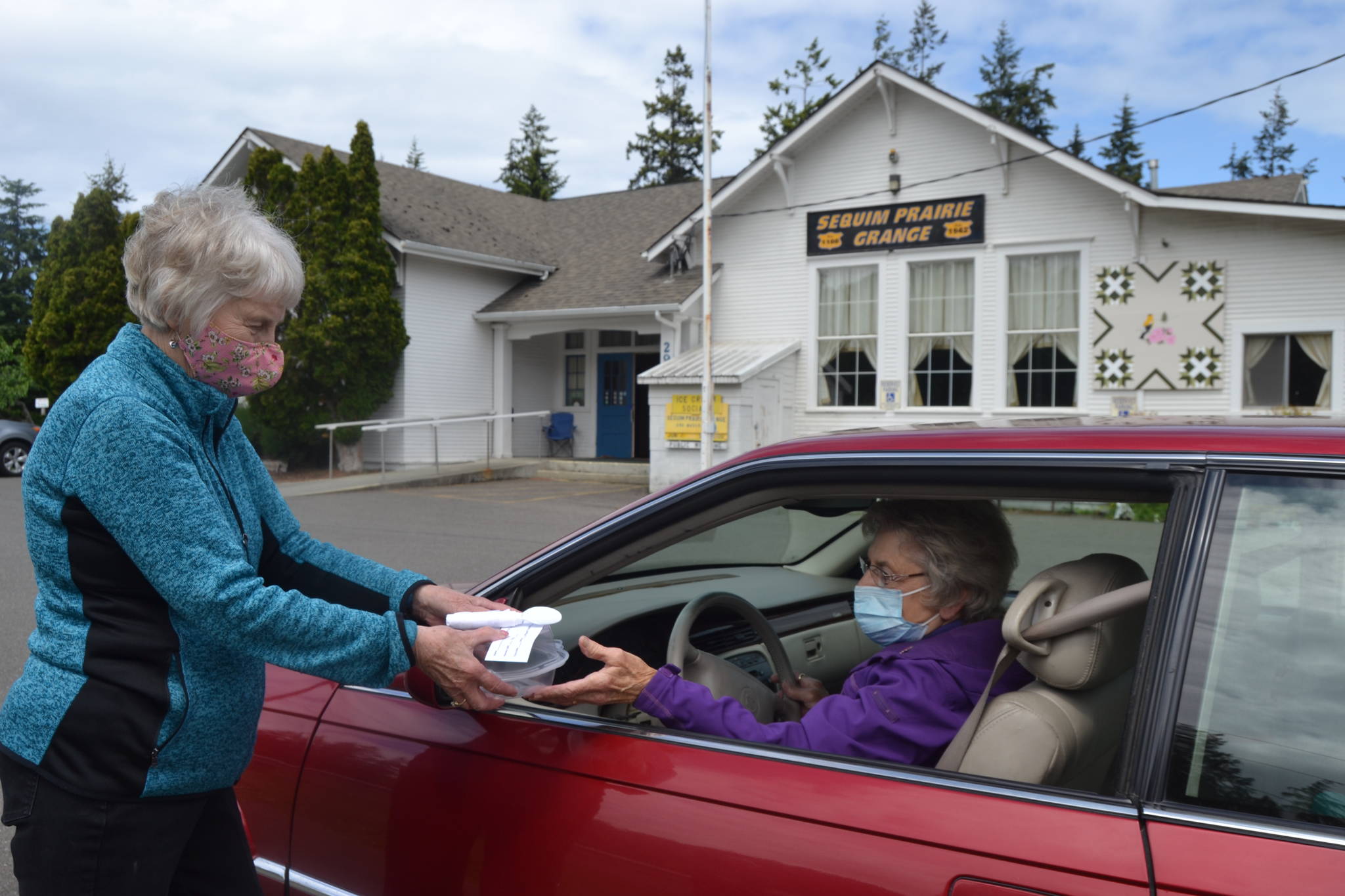 Loretta Bilow holds a practice run with Bonnie Hagberg for the Sequim Prairie Granges upcoming Drive-Up Ice Cream Social on June 7. Organizers said proceeds support the Granges bills and maintenance costs since protocols went into place to prevent the spread of COVID-19. Sequim Gazette photos by Matthew Nash