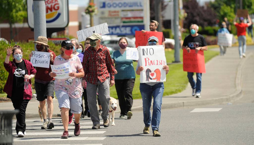 Hundreds of protesters march east on Washington Street on June 3, decrying racism and calling for change. Sequim Gazette photo by Michael Dashiell