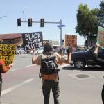 From left, Mackenzie Grinnell, Peter Beeler and Jaiden Dokken hold signs at the corner of Washington Street and Sequim Avenue on June 3, protesting racism and the death of George Floyd and other black people at the hands of police officers. Sequim Gazette photo by Michael Dashiell