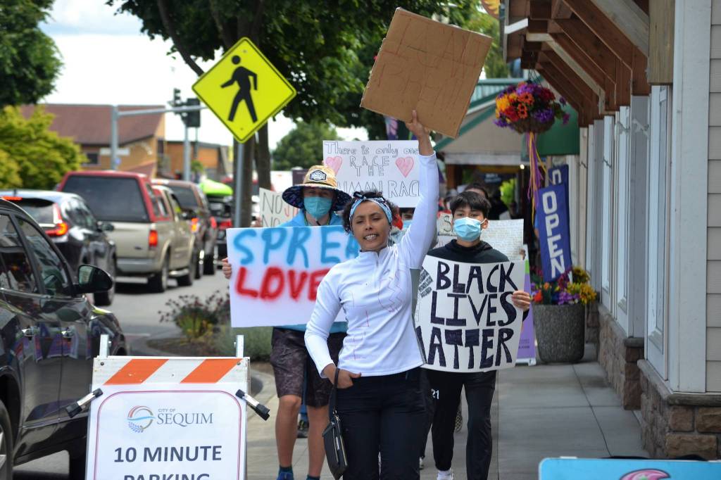 Holding a sign that reads I cant breathe, Gabriel Stark of Sequim leads a group of about 200 people along Washington Street on June 4. She said its really touching to see so many people from Sequim participate. Sequim Gazette photo by Matthew Nash