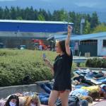 Nia Haley of Sequim videos demonstrators on June 4 at the circle the River Road roundabout in support of the Black Lives Matter movement. They laid on the ground for 8 minutes and 46 seconds to honor the memory of George Floyd and oppose police brutality. Sequim Gazette photo by Matthew Nash