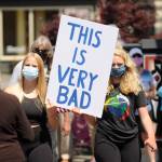 Joei Darminio, left, and Allie Van De Wege join protesters at Washington Street and Sequim Avenue. Sequim Gazette photo by Michael Dashiell
