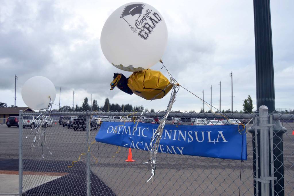 Visitors of Olympic Peninsula Academys graduation parked their cars to watch Olympic Peninsula Academys Class of 2020. Sequim Gazette photo by Matthew Nash