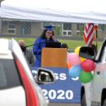 Lily Engeset, at podium, was one of six Olympic Peninsula Academy students to speak and be honored for graduating on June 12 at an outdoor ceremony. Sequim Gazette photo by Matthew Nash