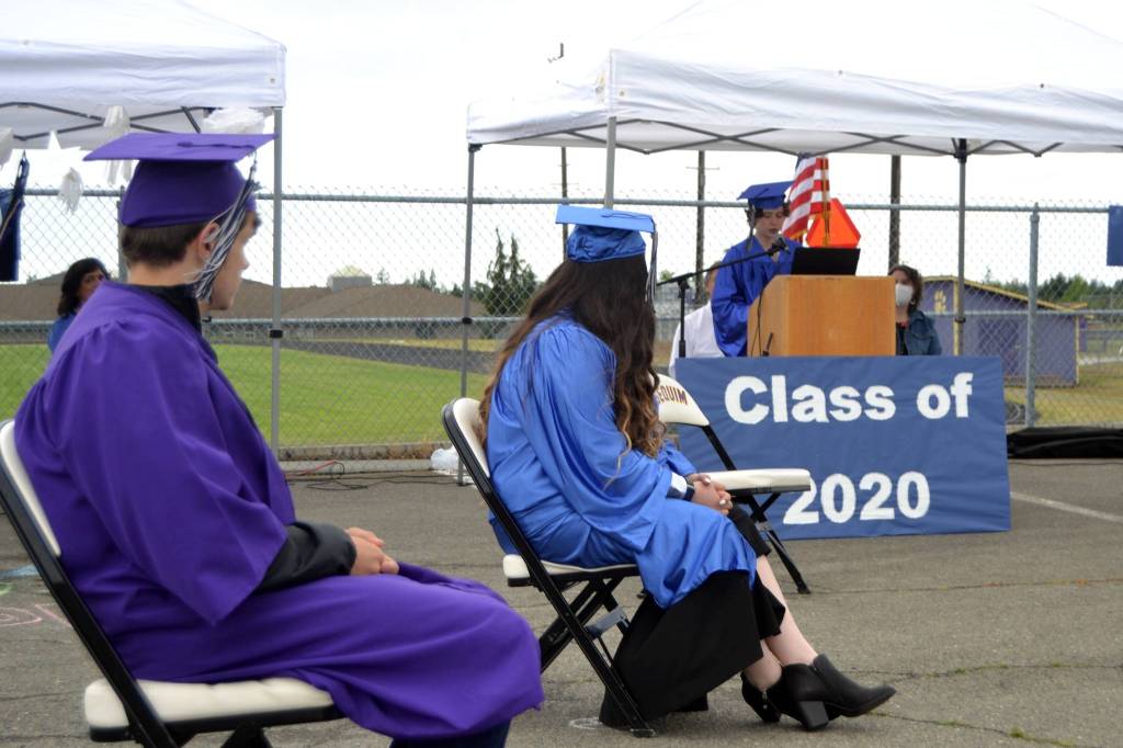Gianna Halo, at podium, was one of six Olympic Peninsula Academy students to speak and be honored for graduating on June 12 at an outdoor ceremony. Sequim Gazette photo by Matthew Nash