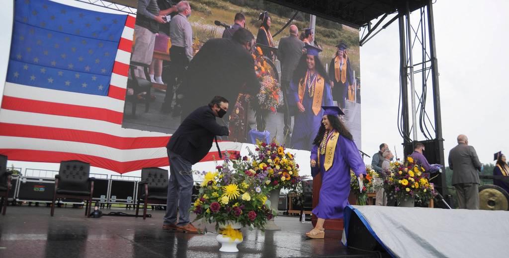 Araceli Lopez gets an elbow bump from Sequim High School principal Shawn Langston at Fridays SHS commencement ceremony. Sequim Gazette photo by Michael Dashiell