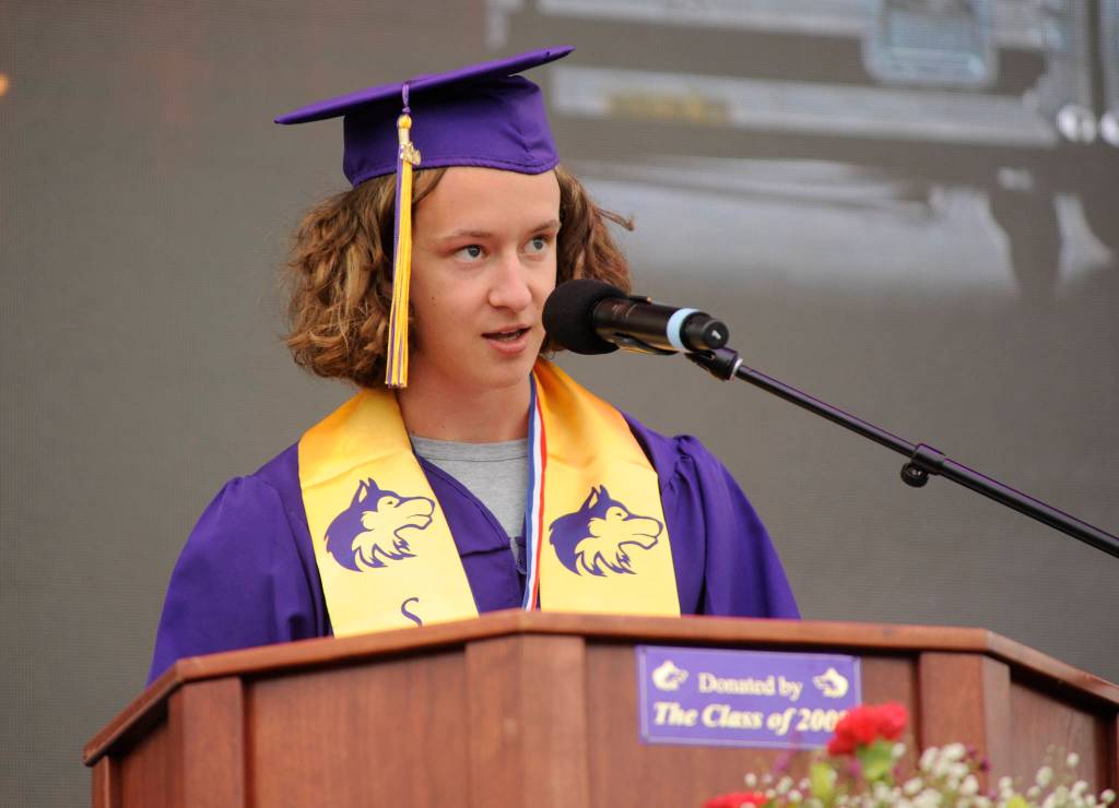 Student-selected speaker Michael McAleer addresses the drive in crowd at SHSs graduation ceremony Friday evening. Sequim Gazette photo by Michael Dashiell