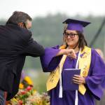 Tigerlilly McMeen gets an elbow bump from Sequim High School principal Shawn Langston at Fridays SHS commencement ceremony. Sequim Gazette photo by Michael Dashiell
