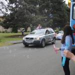 Kim Rosales, far right and Mary Budke blow bubbles for Lydia Stidham and other Sequim High seniors at Fridays graduation ceremony. Sequim Gazette photo by Michael Dashiell