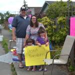 On June 20, the Hannam family sat outside their downtown Sequim home waving to cars in honor of Noras third birthday, See story on Page 3. Sequim Gazette photo by Matthew Nash