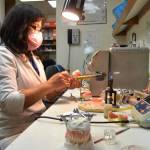 Lien Trinh, owner of DentureCare Inc., prepares some dentures for patients at her West Spruce Street business. Shes one of many Sequim businesses slated to receive a business grant from the City of Sequim to help during the pandemic. Sequim Gazette photo by Matthew Nash