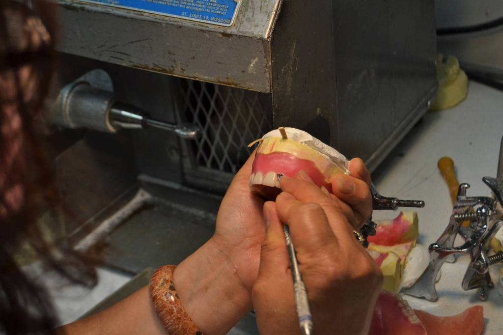 Lien Trinh, owner of DentureCare Inc., prepares some dentures for patients at her West Spruce Street business. Shes one of many Sequim businesses slated to receive a business grant from the City of Sequim to help during the pandemic. Sequim Gazette photo by Matthew Nash