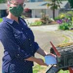 Dana Seevers, North Olympic Library System customer service specialist, sends packets from the NOLS Grows Seed Library to library users. Submitted photo