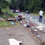Debris was scattered along state Highway 112 near Dodger Lane after a June 26 two-car collision. Submitted photo