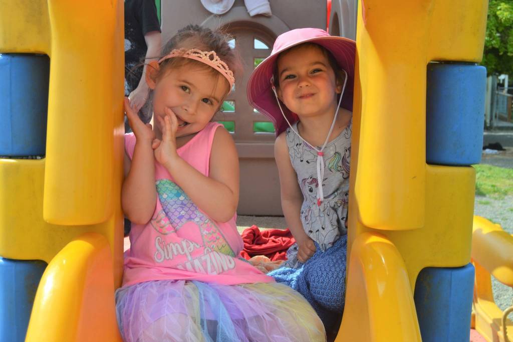 Four-year-olds Paisley Allen, left, and Stella Good enjoy some playtime at Sequims Little Explorers Early Learning Center. Theyre part of an outdoor preschool class to allow for social distancing. Business co-owner Erin Bell said (The kids) are pretty resilient. We hear them a lot say, I wish this virus would go away. They feel it. Sequim Gazette photo by Matthew Nash