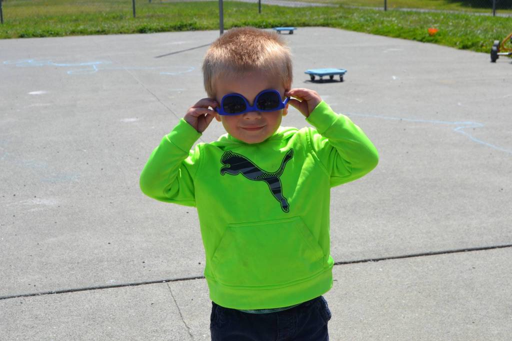 Jake Price basks in the sun with some styling shades at Bibity Bobity day care. Sequim Gazette photo by Matthew Nash
