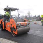 Crews from Lakeside Industries and Interwest Construction pave West Fir Street in late March. The City of Sequim hosts a ribbon cutting on July 9 to celebrate the projects completion. Sequim Gazette file photo by Michael Dashiell