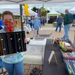 Ruby Romano, 16, offers her beadwork artistry each Saturday during the Sequim Farmers & Artisans Market season. Photo by Emma Jane Garcia