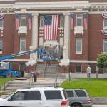 Clallam County Courthouse workers hang bunting on the front of the historic Port Angeles courthouse on Wednesday in honor of Independence Day. Photo by Keith Thorpe/Olympic Peninsula News Group