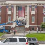 Clallam County Courthouse workers hang bunting on the front of the historic Port Angeles courthouse on Wednesday in honor of Independence Day. Photo by Keith Thorpe/Olympic Peninsula News Group