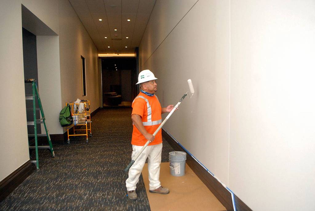 Wilder Pedroza of Spokane-based Custom Painting prepares a ground-floor hallway at the 7 Cedars Hotel on July 7. Photo by Keith Thorpe/Olympic Peninsula News Group