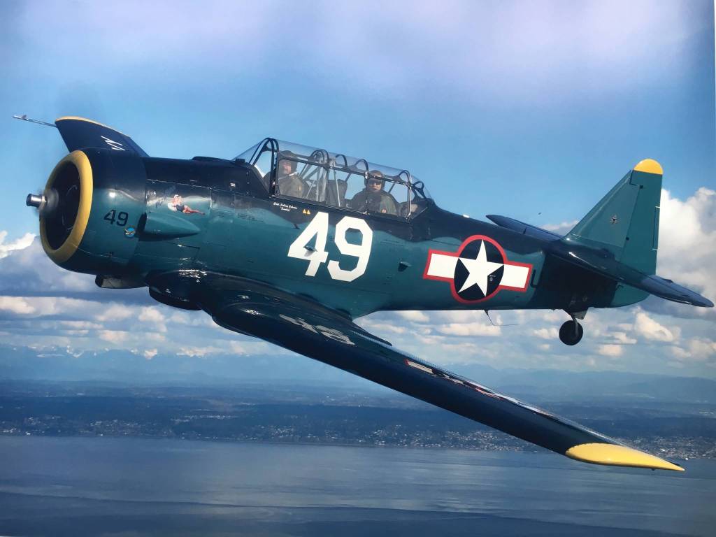 This T-6 Texan and pilot/owner John Johnson and crew chief Dave Richardson, not pictured, will travel to Oahu this month to participate in the 75th anniversary of the end of World War II in the Pacific Ocean. Theyll quarantine aboard the USS Essex for 14 days and spend some time in Hawaii before commemorating the occasion Aug. 29-Sept. 2. The planes number is now No. 48. Photo courtesy of John Johnson